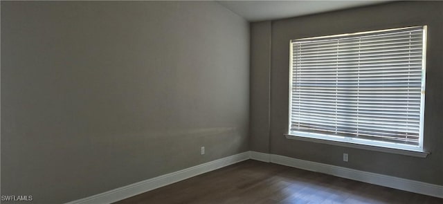 315 Cleveland Ave, Lehigh Acres, FL 33936 - spare room with baseboards and dark wood-style floors