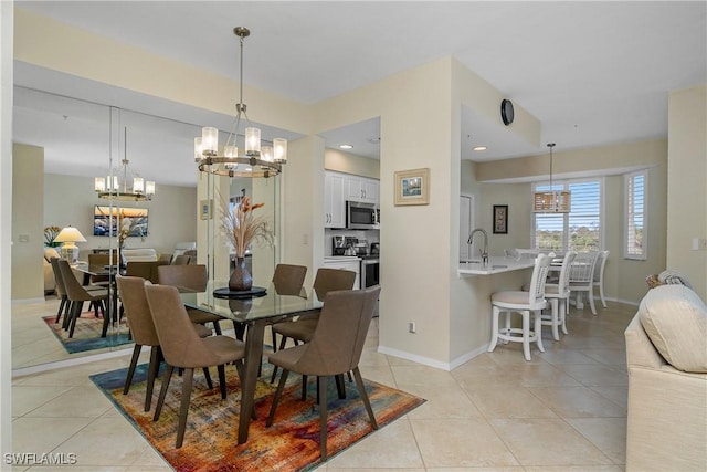 7505 Stoneybrook Dr Unit 746, Naples, FL 34112 - dining room featuring baseboards, light tile patterned flooring, and a notable chandelier