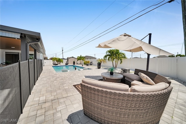 202 NE 16th Ter, Cape Coral, FL 33909 - view of patio / terrace with a fenced in pool and a fenced backyard