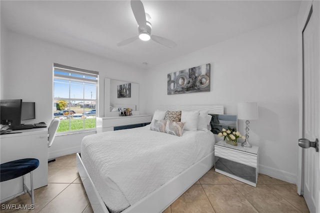 202 NE 16th Ter, Cape Coral, FL 33909 - bedroom with baseboards, ceiling fan, and light tile patterned floors