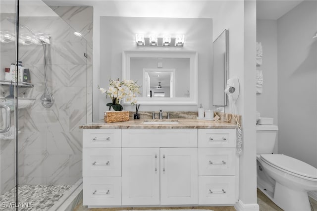 202 NE 16th Ter, Cape Coral, FL 33909 - full bathroom with a marble finish shower, vanity, and toilet