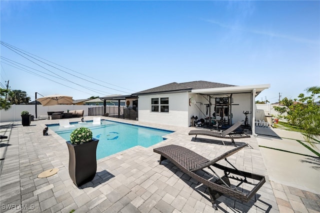 202 NE 16th Ter, Cape Coral, FL 33909 - view of pool with a fenced in pool, a fenced backyard, and a patio area