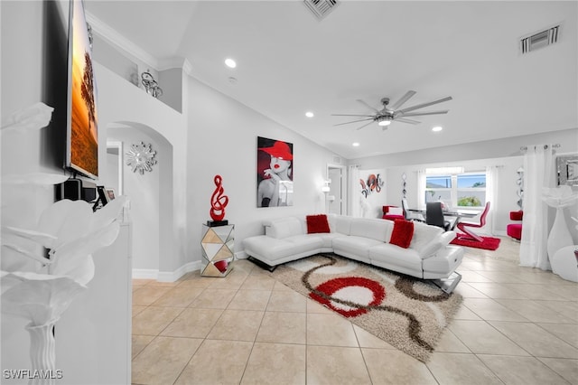 202 NE 16th Ter, Cape Coral, FL 33909 - living area with visible vents, a ceiling fan, arched walkways, and light tile patterned flooring