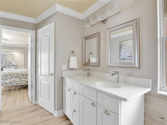 11526 Forest Mere Dr, Bonita Springs, FL 34135 - full bathroom featuring ornamental molding, double vanity, a sink, and wood finished floors