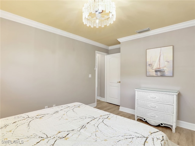 11526 Forest Mere Dr, Bonita Springs, FL 34135 - bedroom featuring wood finished floors, visible vents, a chandelier, crown molding, and baseboards