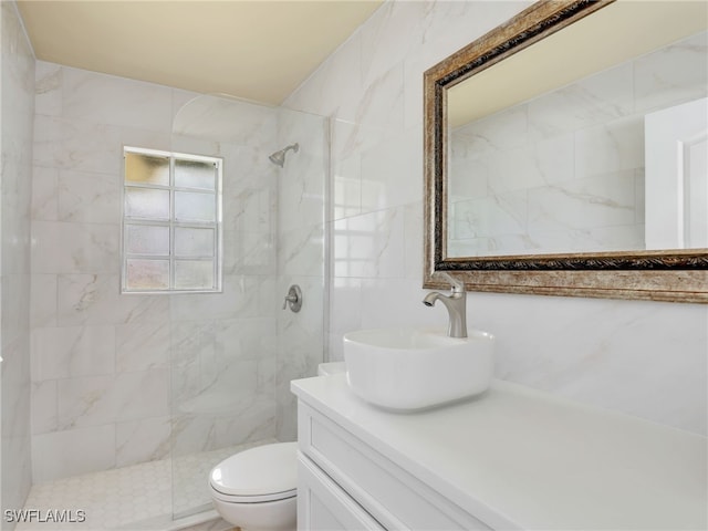11526 Forest Mere Dr, Bonita Springs, FL 34135 - full bathroom featuring a tile shower, tile walls, vanity, and toilet