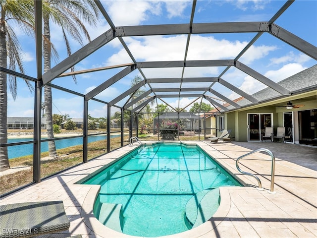 11526 Forest Mere Dr, Bonita Springs, FL 34135 - pool featuring a patio, a water view, a ceiling fan, and glass enclosure