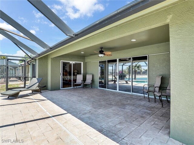 11526 Forest Mere Dr, Bonita Springs, FL 34135 - view of patio featuring ceiling fan, a lanai, and an outdoor pool