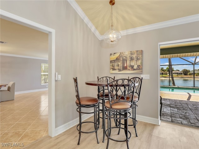 11526 Forest Mere Dr, Bonita Springs, FL 34135 - tiled dining space with crown molding, a wealth of natural light, and baseboards