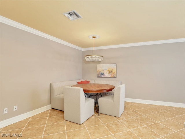 11526 Forest Mere Dr, Bonita Springs, FL 34135 - tiled dining space featuring baseboards, crown molding, an inviting chandelier, and visible vents