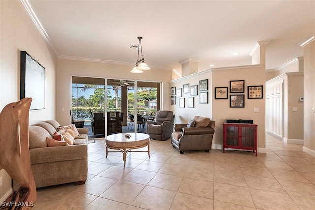 living room featuring crown molding, a ceiling fan, baseboards, light tile patterned floors, and visible vents