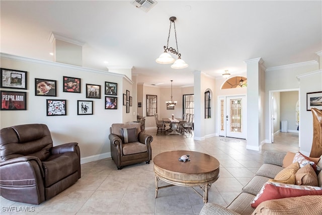 living room with visible vents, crown molding, baseboards, a chandelier, and light tile patterned floors