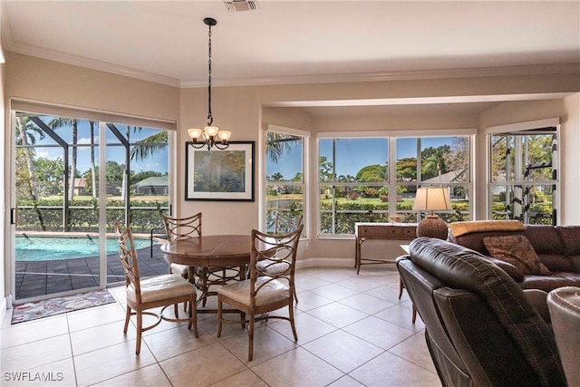 dining area featuring crown molding, visible vents, baseboards, a chandelier, and light tile patterned floors
