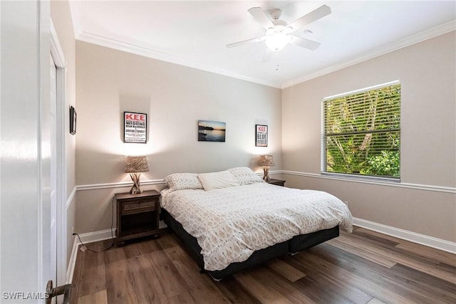 bedroom featuring crown molding, baseboards, and dark wood-type flooring