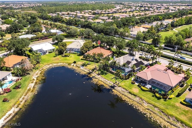 drone / aerial view featuring a water view and a residential view