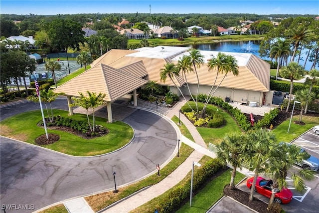drone / aerial view featuring a water view and a residential view