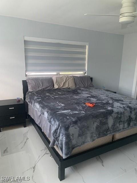 bedroom with marble finish flooring