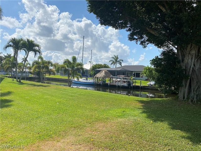 view of grassy yard with a water view
