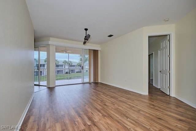 14571 Grande Cay Cir Unit 3203, Fort Myers, FL 33908 - empty room with baseboards, ceiling fan, wood finished floors, and visible vents