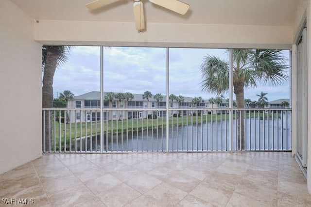 14571 Grande Cay Cir Unit 3203, Fort Myers, FL 33908 - unfurnished sunroom featuring a water view