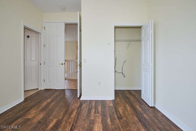 14571 Grande Cay Cir Unit 3203, Fort Myers, FL 33908 - unfurnished bedroom featuring baseboards, wood finished floors, and a closet