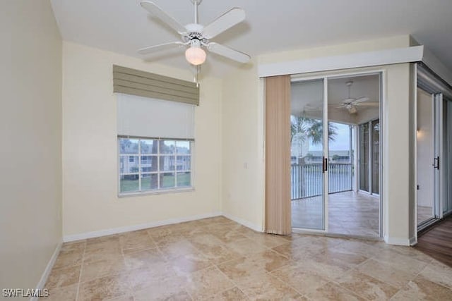 14571 Grande Cay Cir Unit 3203, Fort Myers, FL 33908 - empty room with baseboards, a ceiling fan, and a healthy amount of sunlight
