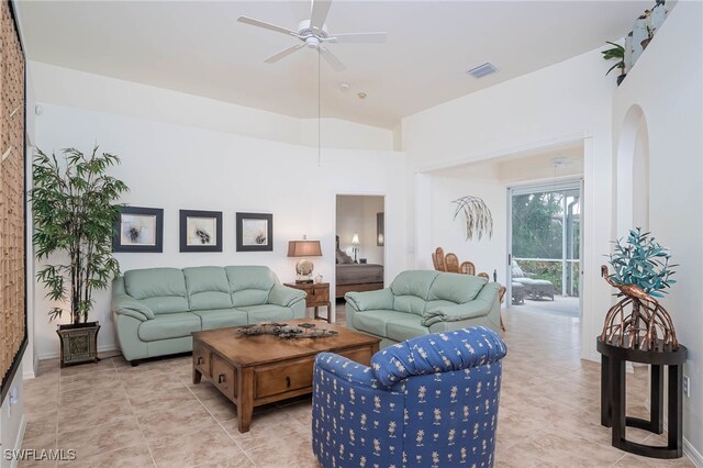 living room with ceiling fan, tile patterned floors, and visible vents