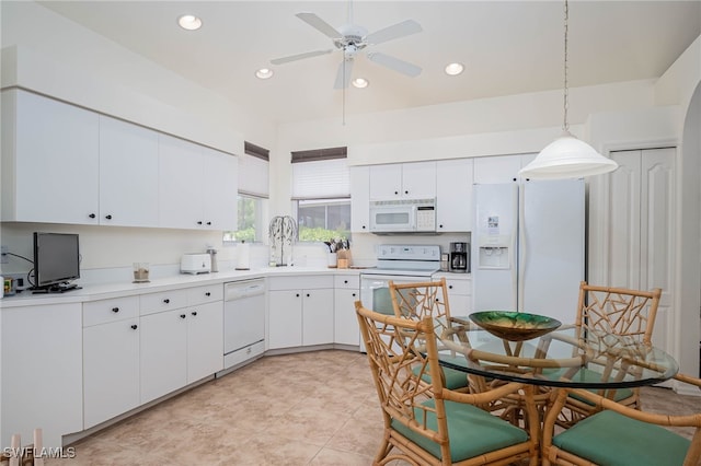 kitchen featuring white cabinets, decorative light fixtures, a ceiling fan, and white appliances