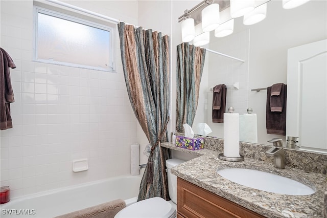 full bathroom with toilet, shower / tub combo, and vanity