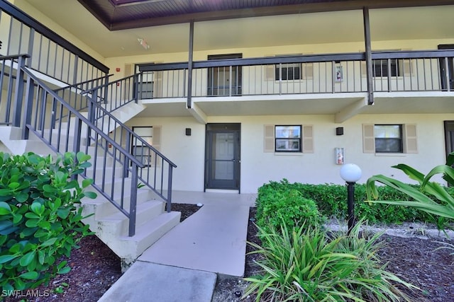 25402 Golf Lake Cir Unit 114, Bonita Springs, FL 34135 - entrance to property with stucco siding