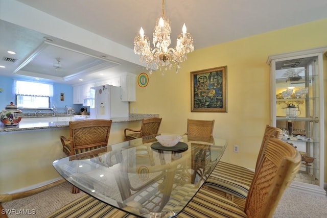 25402 Golf Lake Cir Unit 114, Bonita Springs, FL 34135 - dining room featuring an inviting chandelier, a raised ceiling, and visible vents