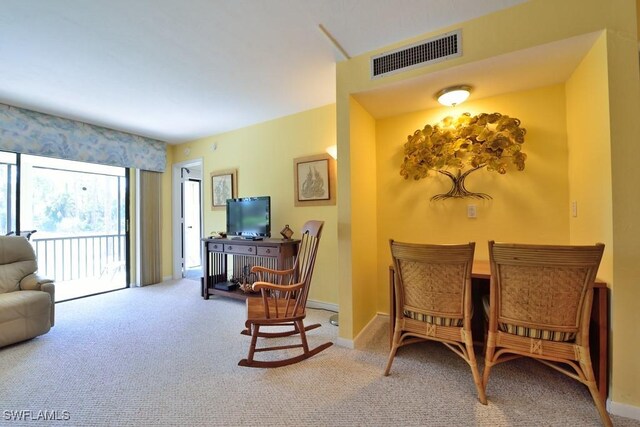 25402 Golf Lake Cir Unit 114, Bonita Springs, FL 34135 - dining space with baseboards, carpet, and visible vents