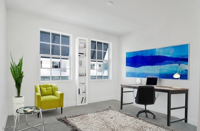 office space with baseboards