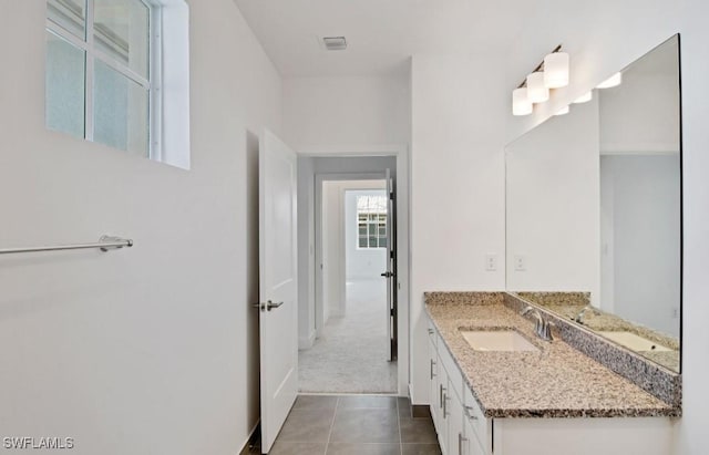 bathroom featuring visible vents, tile patterned flooring, and vanity