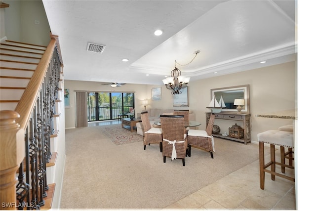 1400 Blue Point Ave Unit 202, Naples, FL 34102 - carpeted dining area featuring stairs, recessed lighting, a raised ceiling, a chandelier, and ceiling fan