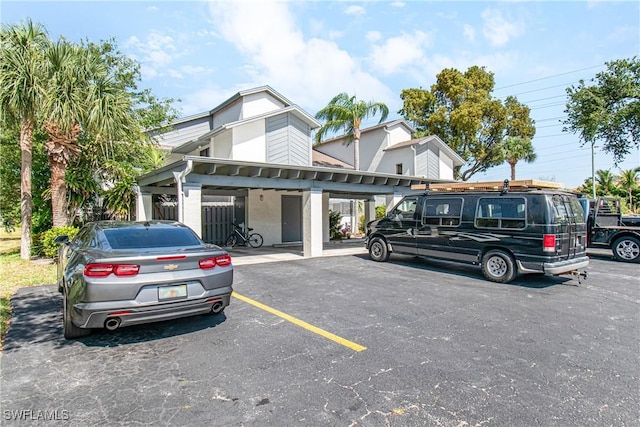 6308 Sugar Bush Ln Unit E, Fort Myers, FL 33908 - townhome / multi-family property with uncovered parking and stucco siding