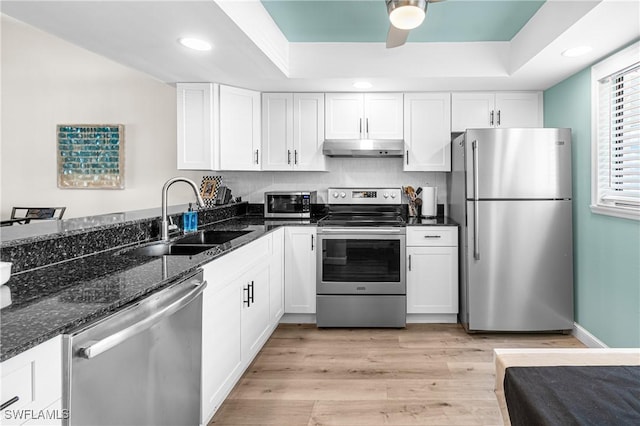 6308 Sugar Bush Ln Unit E, Fort Myers, FL 33908 - kitchen featuring stainless steel appliances, a sink, under cabinet range hood, white cabinets, and recessed lighting