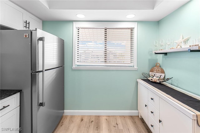 6308 Sugar Bush Ln Unit E, Fort Myers, FL 33908 - kitchen with freestanding refrigerator, baseboards, light wood-type flooring, white cabinets, and recessed lighting