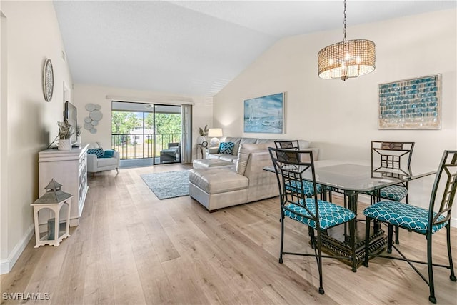 6308 Sugar Bush Ln Unit E, Fort Myers, FL 33908 - dining room with a chandelier, vaulted ceiling, wood finished floors, and baseboards