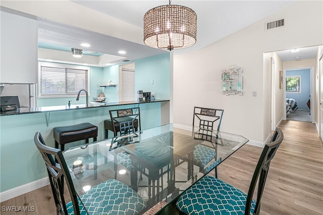 6308 Sugar Bush Ln Unit E, Fort Myers, FL 33908 - dining room with wood finished floors, a chandelier, plenty of natural light, baseboards, and recessed lighting