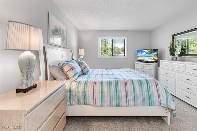 6308 Sugar Bush Ln Unit E, Fort Myers, FL 33908 - carpeted bedroom featuring a textured ceiling