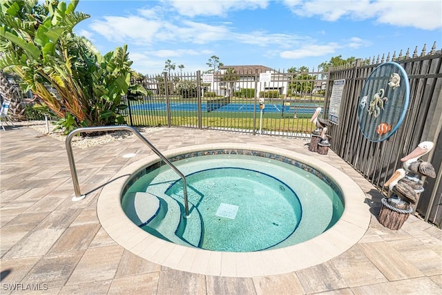 6308 Sugar Bush Ln Unit E, Fort Myers, FL 33908 - view of swimming pool with fence, a tennis court, and a hot tub