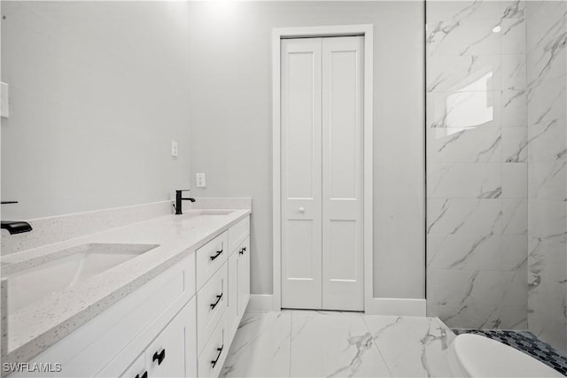 836 Clow St E, Lehigh Acres, FL 33974 - bathroom featuring baseboards, a sink, marble finish floor, and double vanity