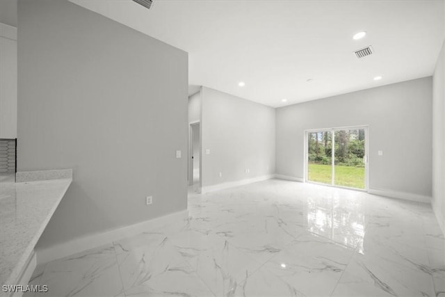 836 Clow St E, Lehigh Acres, FL 33974 - spare room with light marble finish flooring and recessed lighting