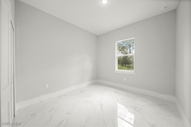 836 Clow St E, Lehigh Acres, FL 33974 - unfurnished room with marble finish floors, a smoke detector, and recessed lighting