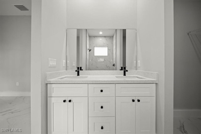 836 Clow St E, Lehigh Acres, FL 33974 - bathroom with marble look tiles, a marble finish shower, and double vanity