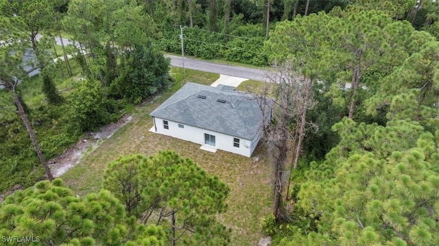 836 Clow St E, Lehigh Acres, FL 33974 - aerial view of property and surrounding area with a forest
