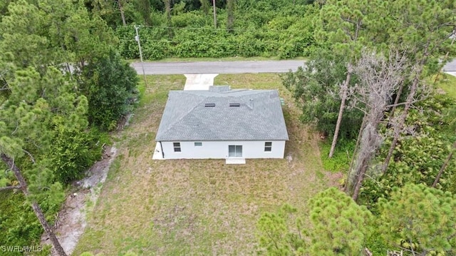 836 Clow St E, Lehigh Acres, FL 33974 - aerial view of property and surrounding area with a heavily wooded area