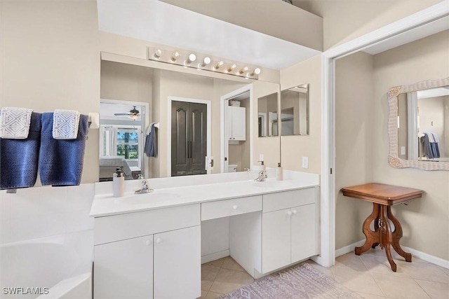 10225 Bismark Palm Way Unit 1626, Fort Myers, FL 33966 - full bathroom featuring tile patterned floors, double vanity, a bath, a ceiling fan, and baseboards