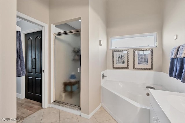 10225 Bismark Palm Way Unit 1626, Fort Myers, FL 33966 - bathroom with a shower stall, a garden tub, baseboards, and vanity